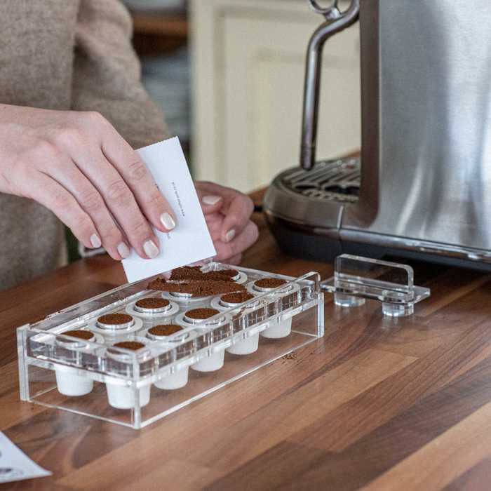 Coffee Pods being filled with ground coffee