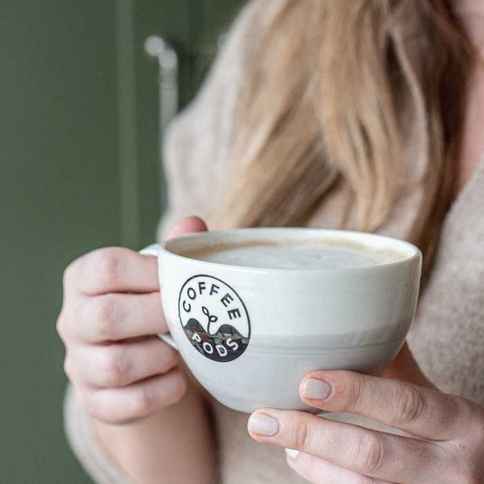 Lady holding a cup of coffee